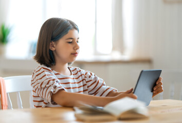 Girl doing homework or online education.