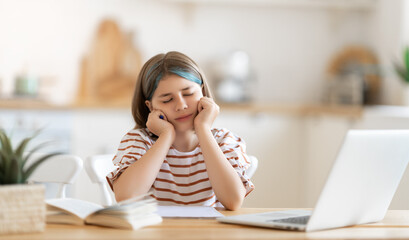 Girl doing homework or online education.