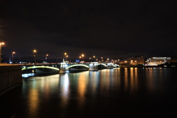 Night bridge across the Neva