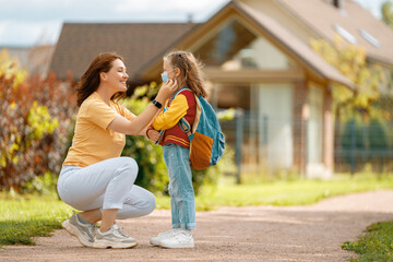 Parent and pupil going to school