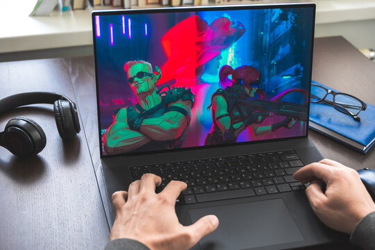 Russia Moscow 30.05.2021.Logo, screenshot of blockchain nft ethereum cryptocurrency kiber punk game Neon District in laptop screen. Man playing,collecting cards. Earning tokens, digital money at home