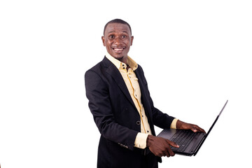 young businessman holding laptop computer smiling.