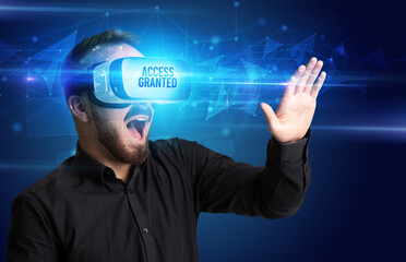 Businessman looking through Virtual Reality glasses, virtual security concept