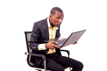 seated businessman brings the laptop close to his eyes to see well.