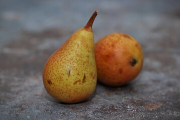 Ripe pears on rustic table