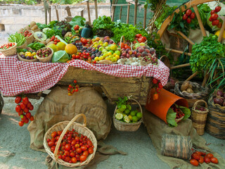 A selection of fruits and vegetables on an open market.