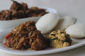 Steamed rice cake is popularly known as Idly in India is one of the healthiest breakfast item of Indian Cuisine. Served with Kerala style spicy mutton roast and chutney.