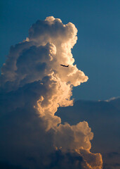 Dramatic Thunderheads at Sunset with Airliner.