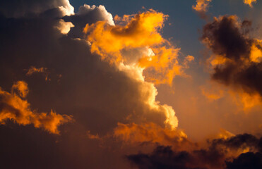 Sunset Paints Gathering Storm Clouds a Dramatic Orange.