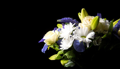Funeral Bouquet purple White flowers, Sympathy and Condolence Concept on blackbackground with copy...