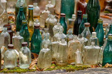 Old bottles of various drinks.
