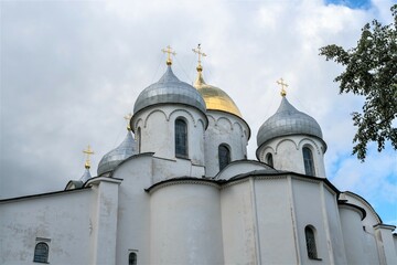 Fototapeta na wymiar Russia, Veliky Novgorod, August 2021. View of the walls, domes and crosses of St. Sophia Cathedral.