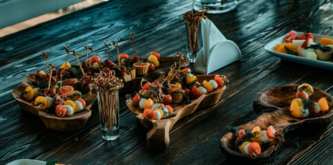 food in wooden dishes on a wooden table