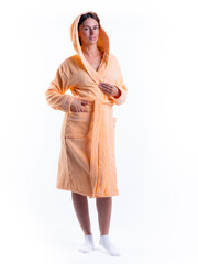 woman in a Bathrobe on an isolated white background with a smile on her face.