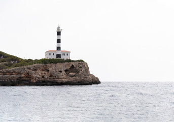 Fototapeta na wymiar Mediterranean Sea, lighthouse of Portocolom, Majorca island, Spain.