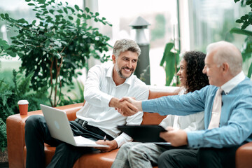 business partners greeting each other with a handshake. - 451044768