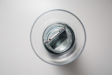 Mobile phone waterproof in vessel with water.