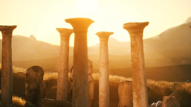old greek temple ruins at sunset