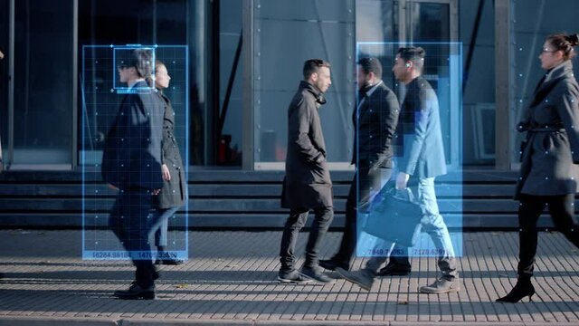 Crowd of Business People Tracked with Technology Walking on Busy Urban City Streets. CCTV AI Facial Recognition Big Data Analysis Interface Scanning, Showing Animated Information.