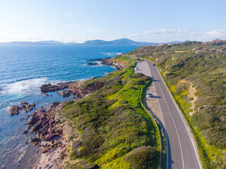 Coastal road to Alghero under a clear sky