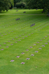 Obraz premium La Cambe, France - 08 03 2021: Normandy German military cemetery and Memorial and the black crosses