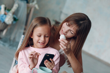 Mother and little daughter child girl at home