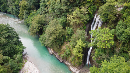 Aerial view of the Orekhovsky waterfall and the blue river. Sochi, Russia.