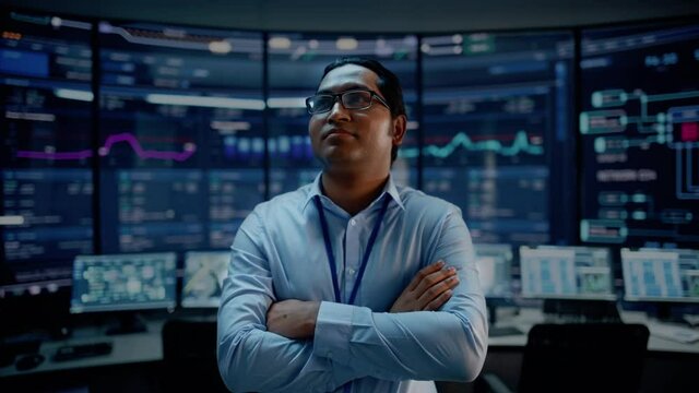 First Person POV Footage of Professional IT Technical Support Specialist or Software Engineer Pushing Augmented Reality Display in a Modern Monitoring Control Room Full of Computers. VFX Animation.