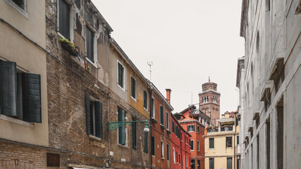 Fototapeta na wymiar Tower over traditional Venetian houses, Venice, Italy