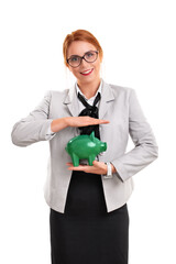 Beautiful smiling businesswoman holding green piggy bank