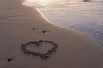 heart painted on the sand by the baltic sea