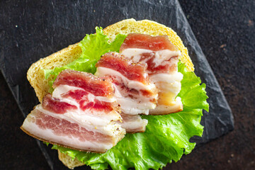 salted lard raw homemade pork fat smoked, dry-cured meal snack on the table copy space food background rustic. top view