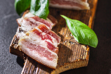 salted lard raw homemade pork fat smoked, dry-cured meal snack on the table copy space food background rustic. top view