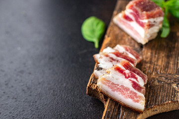 salted lard raw homemade pork fat smoked, dry-cured meal snack on the table copy space food background rustic. top view