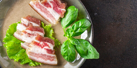 salted lard raw homemade pork fat smoked, dry-cured meal snack on the table copy space food background rustic. top view