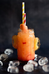 Sex on the beach cocktail in glass on black background