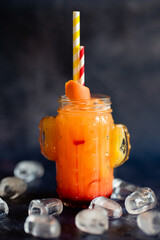 Sex on the beach cocktail in glass on black background