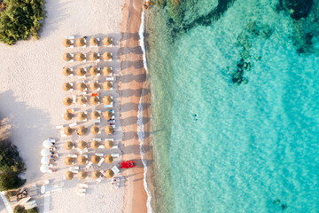 View from above, stunning aerial view of a beautiful beach bathed by a turquoise water and some...