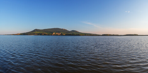 View of Lake Musov and Palava in the Czech Republic. In the background a television transmitter and the ruins of the castle Devicky. - obrazy, fototapety, plakaty