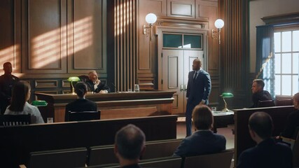 Court of Justice and Law Trial: Male Public Defender Presenting Case, Making Passionate Speech to Judge, Jury. African American Attorney Lawyer Protecting Client's Innocents with Supporting Argument. - Powered by Adobe