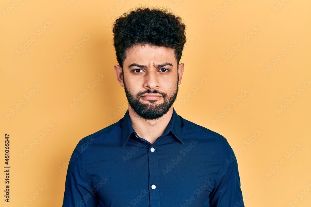 Sticker young arab man with beard wearing casual shirt depressed and worry for distress, crying angry and af