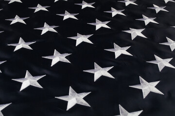 Embroidered stars on the American flag, close-up