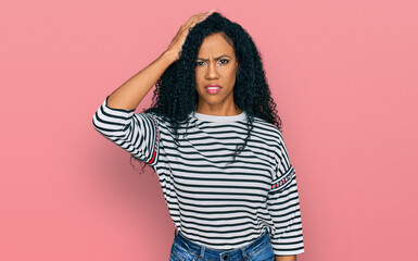 Middle age african american woman wearing casual clothes confuse and wonder about question....