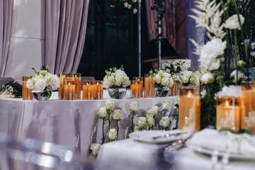 Romantic Wedding Table Top Layout Decor with large lush floral bouquets including white roses,...