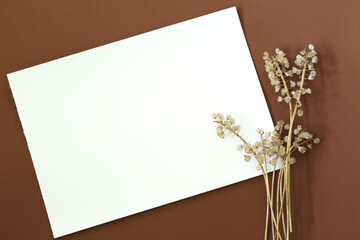 dry flowers with blank paper page
