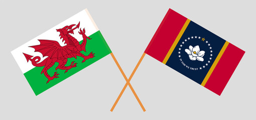 Crossed flags of Wales and the State of Mississippi. Official colors. Correct proportion