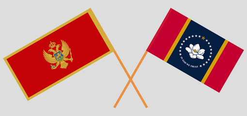 Crossed flags of Montenegro and the State of Mississippi. Official colors. Correct proportion