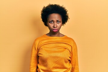 Fototapeta na wymiar Young african american woman wearing casual clothes depressed and worry for distress, crying angry and afraid. sad expression.