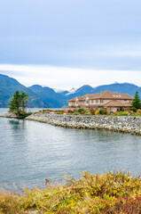 Naklejka premium A perfect neighbourhood. Houses in suburb at Summer in the north America. Luxury houses with nice landscape.