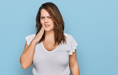 Young plus size woman wearing casual white t shirt touching mouth with hand with painful expression because of toothache or dental illness on teeth. dentist